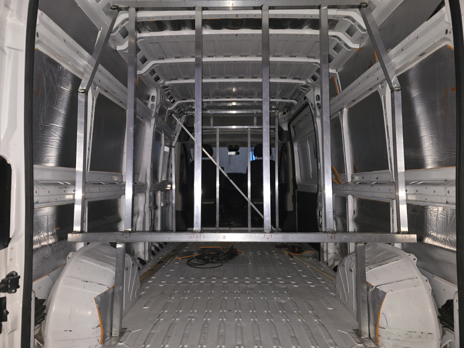 Actual VanGoColorado van build in progress showing welded aluminum structural framework