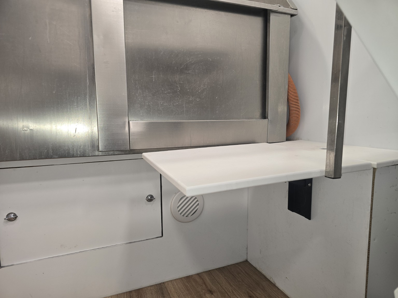 Space-saving fold-down work surface